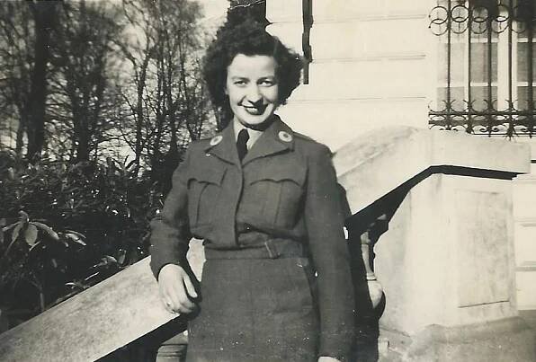 Lilian Harvey on the steps of the building in Versailles where James McNitt worked.
