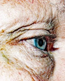 a close up of a man 's blue eye