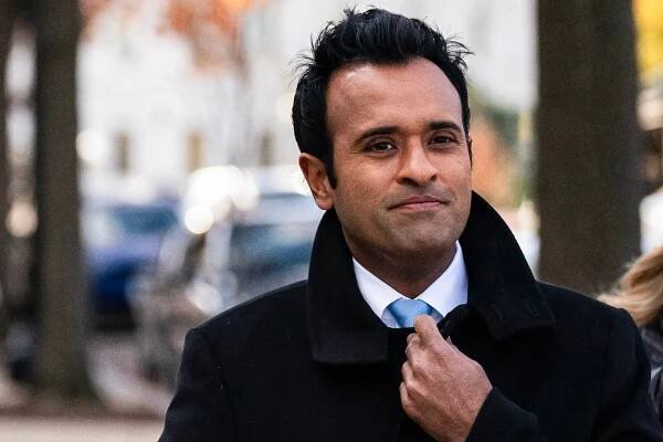 Vivek Ramaswamy with his hand on his collar