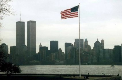 NYC_New_York_Lower_Manhattan_from_Liberty_Island_with_Flag.jpg