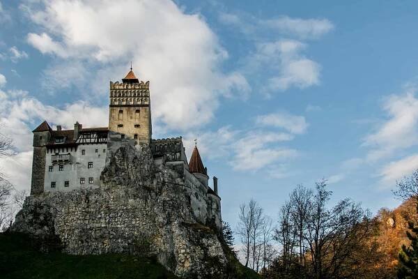 An old castle on top of a rocky mountain.