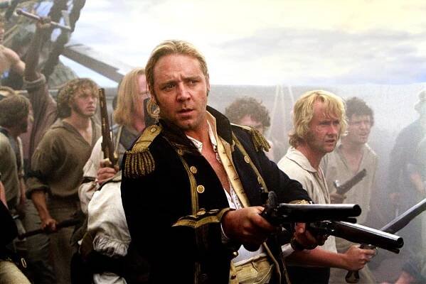 L-R: RUSSELL CROWE as Capt. Jack Aubrey, and BILLY BOYD(right) as Coaxswain Bonden board the French vessel with caution, in the movie MASTER AND COMMANDER: THE FAR SIDE OF THE WORLD.Photo by Stephen Vaughn. courtesy 20th Century Fox***exclusive photo***
