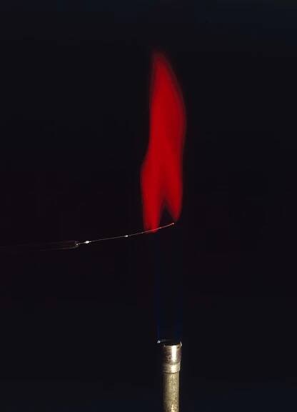 Strontium compounds turn a flame red