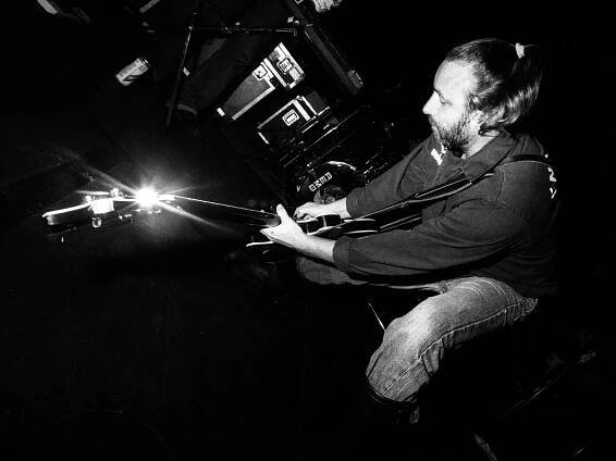 Peter Hook, performs on stage during a tour with his band Revenge, United Kingdom, 1990. (Photo by Martyn Goodacre/Getty Images)