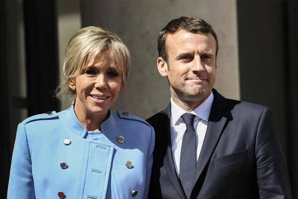 Emmanuel Macron reveals reason why wife Brigitte SHOVED him in face in embarrassing moment in front of world's cameras