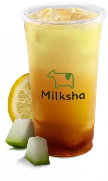 Product shot of wintermelon lemon milk tea with ingredients