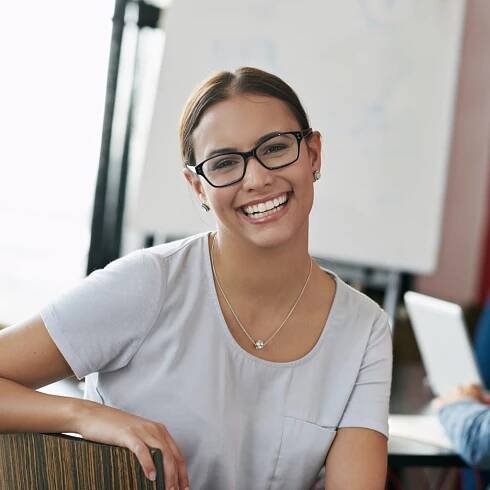 Total job satisfaction. Portrait of a smiling young office worker sitting in a boardroom. Full Mouth Reconstruction