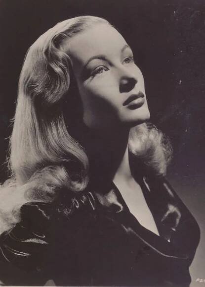 an old black and white photo of a woman