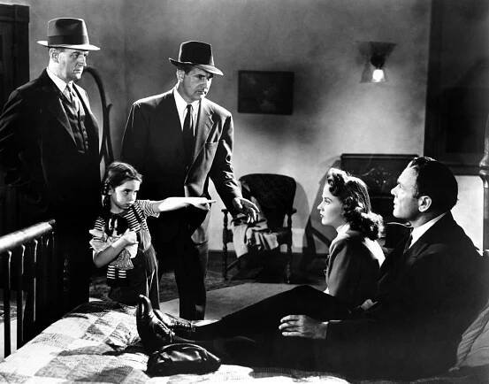 WHEN STRANGERS MARRY, (aka BETRAYED), on bed from left: Kim Hunter, Dean Jagger, 1944