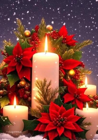 christmas candles with poinsettis and holly wreath on snow covered ground in front of blue sky