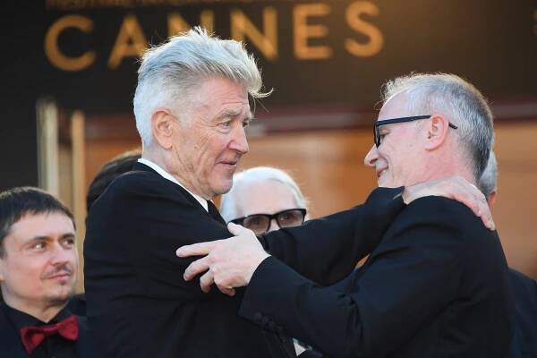 US director David Lynch (L) is greetd by the General Delegate of the Cannes Film Festival Thierry Fremaux as he arrives on May 23, 2017 for the '70th Anniversary' ceremony of the Cannes Film Festival in Cannes, southern France. (Photo by Anne-Christine POUJOULAT / AFP) (Photo by ANNE-CHRISTINE POUJOULAT/AFP via Getty Images)