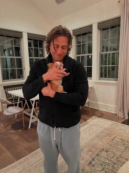 Brad Falchuk with a puppy. 