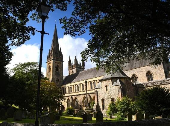 Exterior of Llandaff Cathedral on a sunny day.