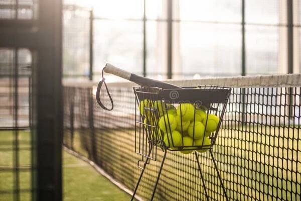 Padel tennis rackets. Sport court and balls. Download a high quality photo with paddle for the design of a sports app or social media advertisement. Sport stock images, royalty-free photos and pictures