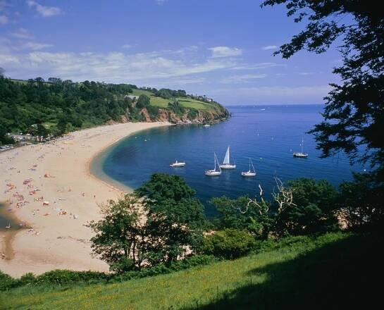 a view of a beach with boats in the water