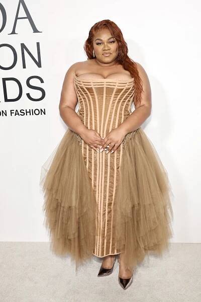Da'vine Joy Randolph in brown dress
