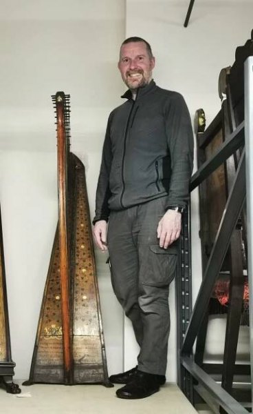 Simon Chadwick with Paul Smith's harp (National Museum of Ireland DF:1906.64). Photo: Brenda Malloy