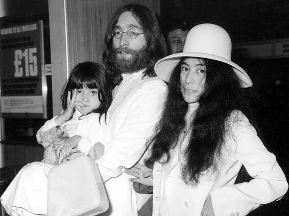 John Lennon and Yoko Ono with Yoko's daughter Kyoko at London's Heathrow airport.