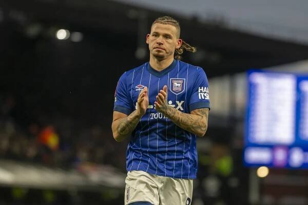 Kalvin Phillips of Ipswich Town preparing to take a corner during a soccer match.