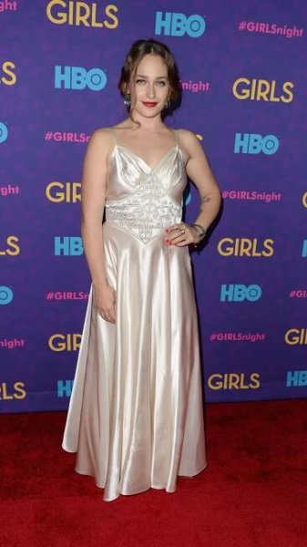 jemima kirke wearing vintage dress on red carpet for girls