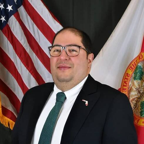 A man wearing a suit and tie