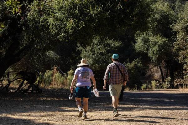 Allan McLeod, right, with Sodaro, at Hahamongna Watershed Park, walking with backs to the camera.