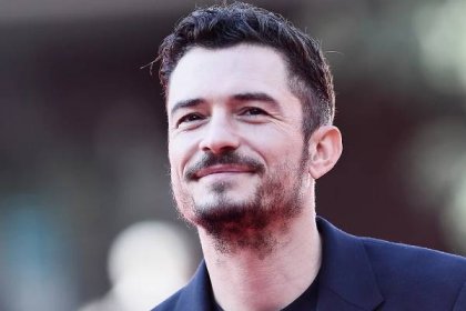 Orlando Bloom fans go wild as he shares completely NUDE photos of himself standing on the shore after...