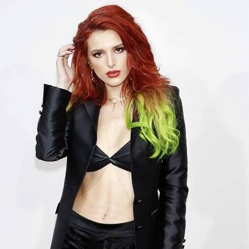 Bella Thorne with red and green hair at the 2016 American Music Awards in Los Angeles