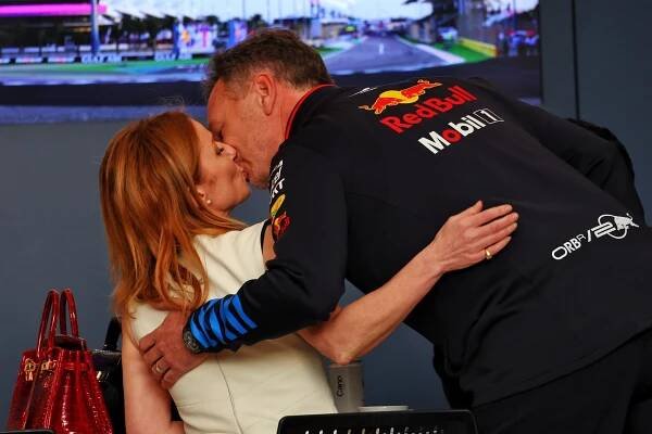 Geri Horner and Christian Horner kissing.