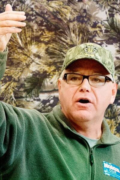 Tim Walz Makes Carhartt and Camo Look Natural