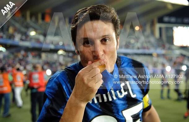 18 December 2010 - 2010 FIFA Club World Cup - Final - TP Mazembe Englebert v FC Internazionale - Javier Zanetti of FC Internazionale Milano kisses his FIFA Club World Cup winners medal