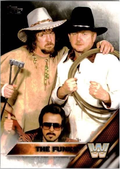 Under the nickname "Hoss", Dory Funk, Jr. worked alongside his brother Terry Funk and Jimmy Jack Funk (not pictured), with manager Jimmy Hart.