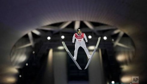 Daiki Ito, of Japan, soars through the air during the men's normal hill individual ski jumping competition at the 2018 Winter Olympics in Pyeongchang, South Korea, Saturday, Feb. 10, 2018. (AP Photo/Kirsty Wigglesworth)
