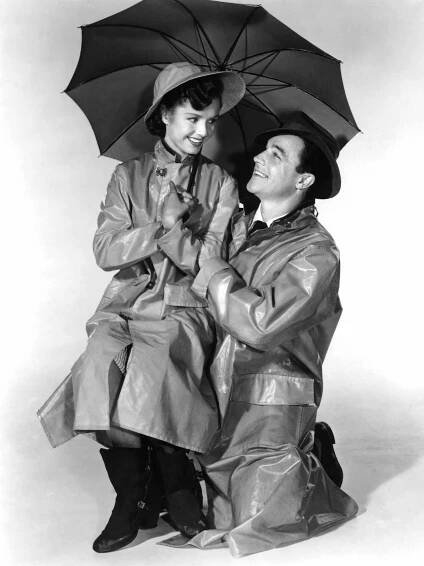 SINGIN' IN THE RAIN, from left, Debbie Reynolds, Gene Kelly, 1952
