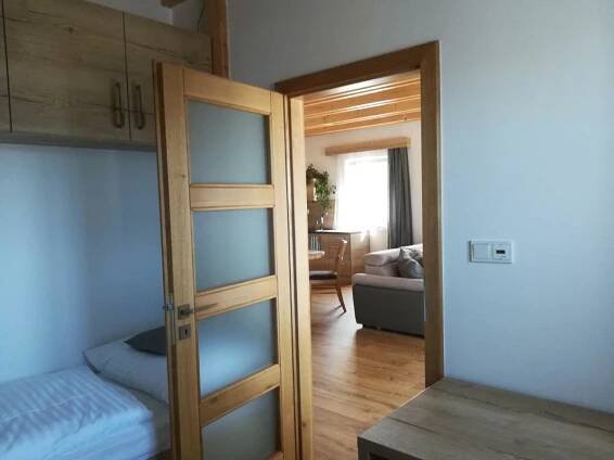 Postel nebo postele na pokoji v ubytování Apartmány U Holubů