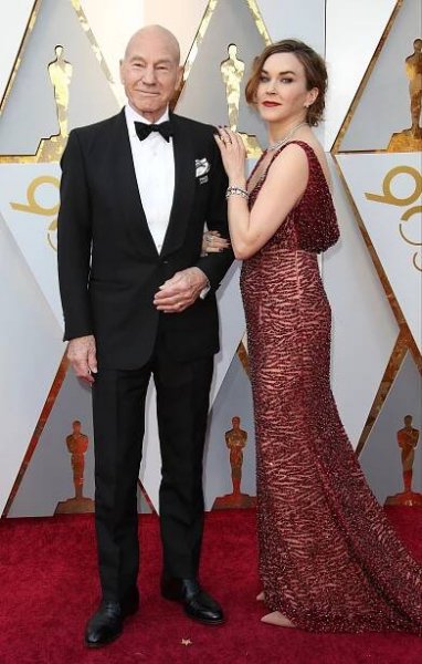 HOLLYWOOD, CA - MARCH 04: Actor Patrick Stewart (L) and Sunny Ozell attend the 90th Annual Academy Awards at Hollywood & Highland Center on March 4, 2018 in Hollywood, California. (Photo by Dan MacMedan/WireImage)