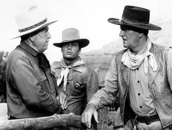 THE COMANCHEROS, from left: Bruce Cabot, Patrick Wayne, John Wayne, 1961, 