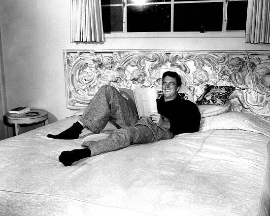 JAMES ARNESS enjoys his king size bed as he reads an upcoming GUNSMOKE script, 1956