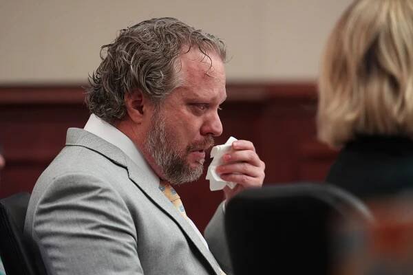 Dentist James Craig wiping tears during his murder trial.