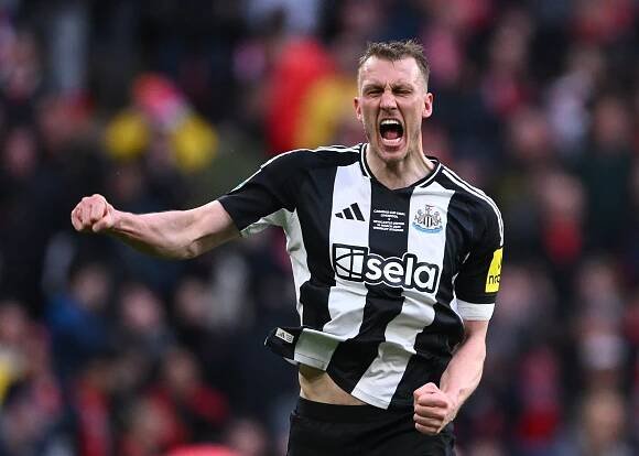 Dan Burn of Newcastle United celebrating a goal.