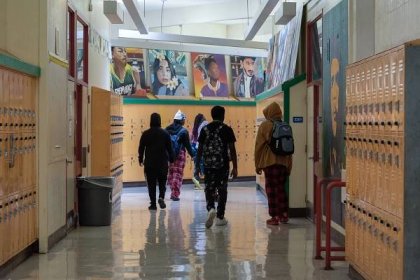 Students walk down a hallway at Fremont High School in Oakland on Oct. 10, 2023. Photo by Laure Andrillon for CalMatters