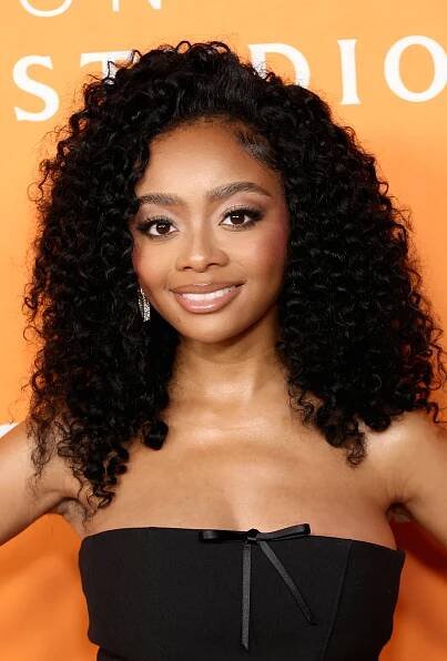 Skai Jackson wearing a strapless black dress with a bow