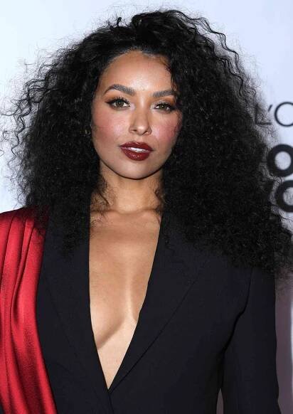 Kat Graham with long, brushed out curls