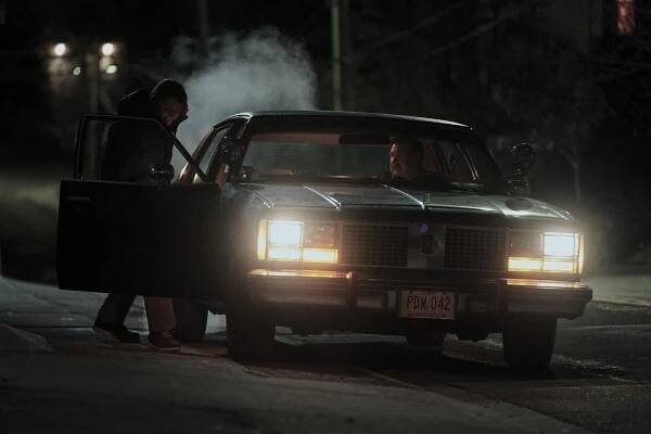 Brandon McEwan as Robert Piest and Michael Chernus as John Wayne Gacy in Devil In Disguise: John Wayne Gacy