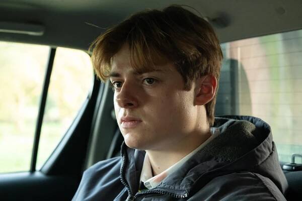 Close-up of Louis Ashbourne Serkis as Johnny Williams in a car.