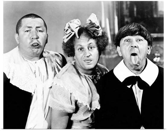 The Three Stooges - Moe Howard, Larry Fine, and Curly Howard - dress as children in this scene from All the World's a Stooge (1941)
