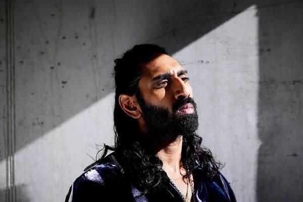 Amar wears velvet shirt by GIORGIO ARMANI.