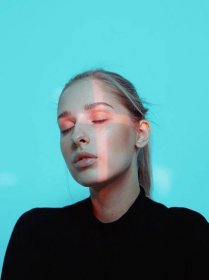 Portrait of Young Pretty Girl with Cross Shaped Light on Her Face with Closed Eyes Stock Image - Image of futuristic, laser: 200085931