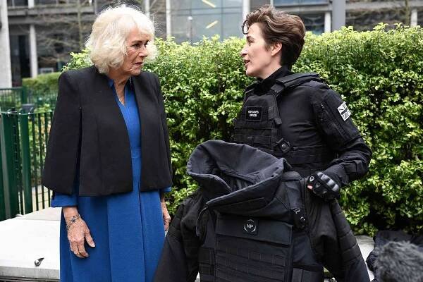 LONDON, ENGLAND - MARCH 27: Queen Camilla meets the cast on the set the cast including Vicky McClure who showed her the bomb suit used in filming, during a visit to the set of TV drama Trigger Point, which is currently being filmed on location, on March 27, 2025 in London, England. Accompanied by Dame Carolyn McCall, Chief Executive of ITV, and Executive Producers Jed Mercurio and Jessica Sharkey, Queen Camilla met cast and crew involved in the upcoming third series of Trigger Point, including Vicky McClure and a bomb disposal expert advising the production. Queen Camilla then joined a reception attended by familiar faces from some of ITV's well-known programmes and staff working behind the scenes in a range of areas across the company. Her Majesty also viewed a display looking back on Royal moments in ITV's 70-year history and showcasing ITVÃ¢'s range of work over the years. 