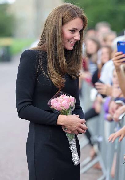 Catherine, Princess of Wales speaks with the public on the long Walk at Windsor Castle on September 10, 2022 in Windsor, England. Crowds have gathered and tributes left at the gates of Windsor Castle to Queen Elizabeth II, who died at Balmoral Castle on 8 September, 2022.